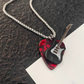 Collar con Púa de Guitarra de Acero de Titanio